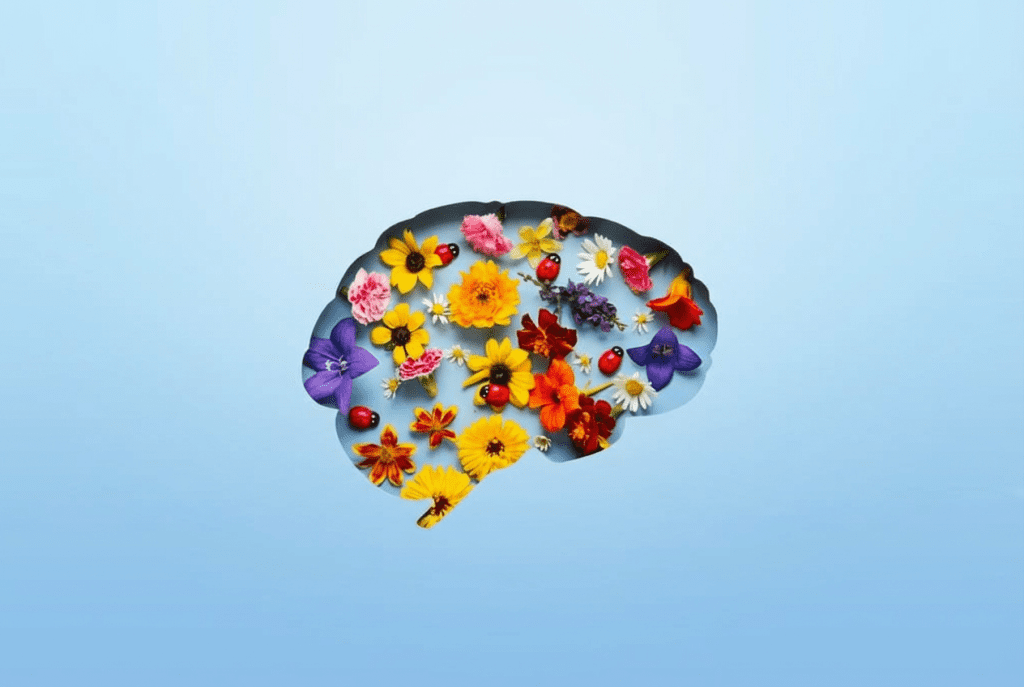 Avaliação neuropsicológica. Cérebro com flores num fundo azul.